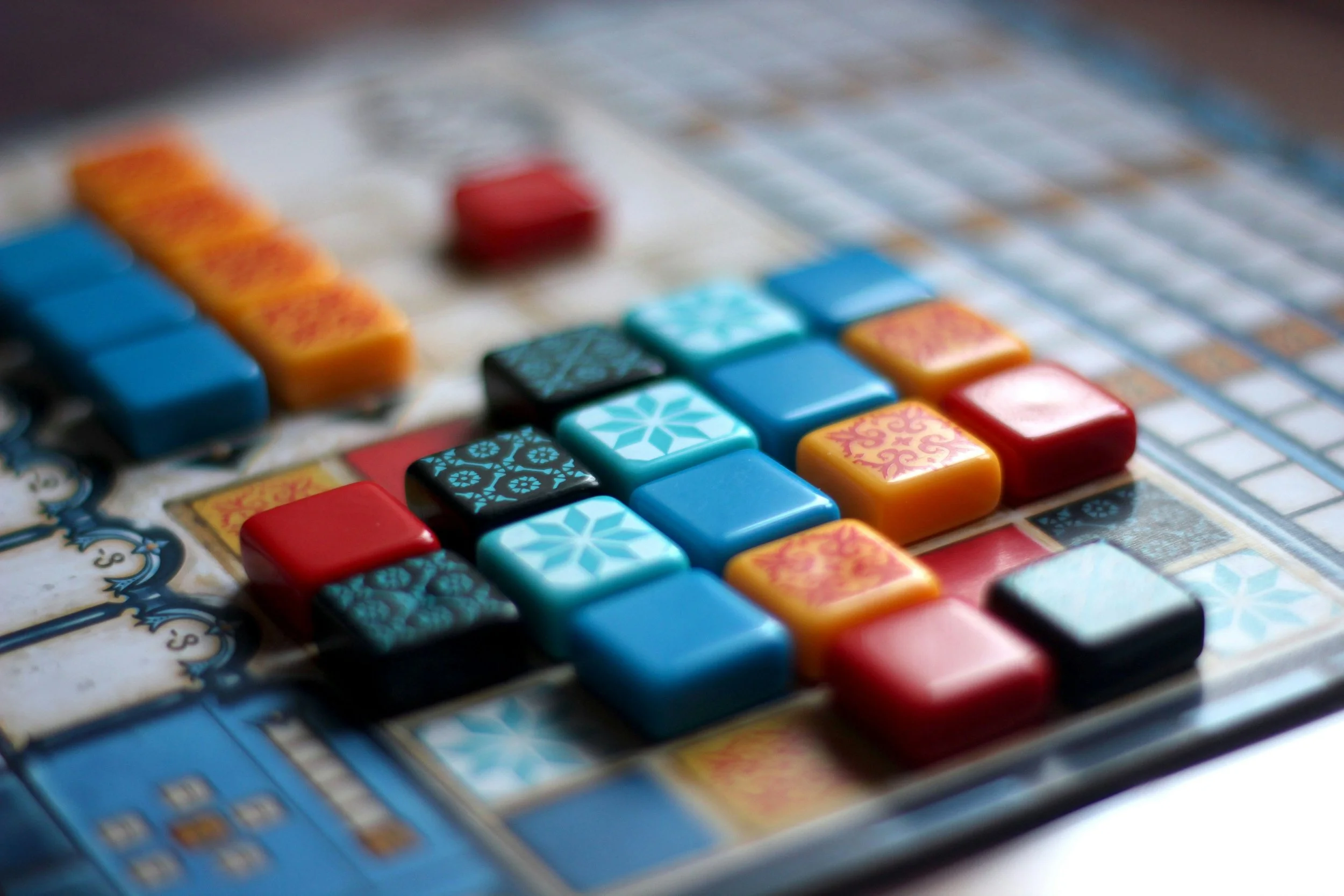 Closeup of game tiles for board game night at Redlight Redlight
