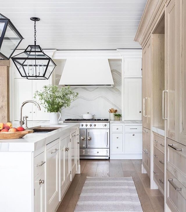 Good morning beauty! 
What features do you find most important when designing a kitchen? 
A few details I&rsquo;m loving here - the shiplap ceiling, pendants, wood grade cabinets, hood fan, range and subtle backsplash movement complimenting the wood 