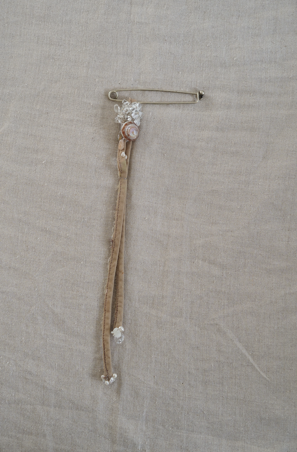 Large metal pin with quartz, pearl & shell adornment