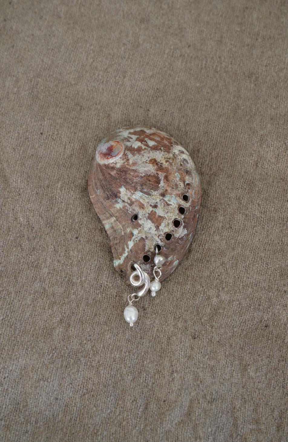 Single silver & reclaimed pearl studs