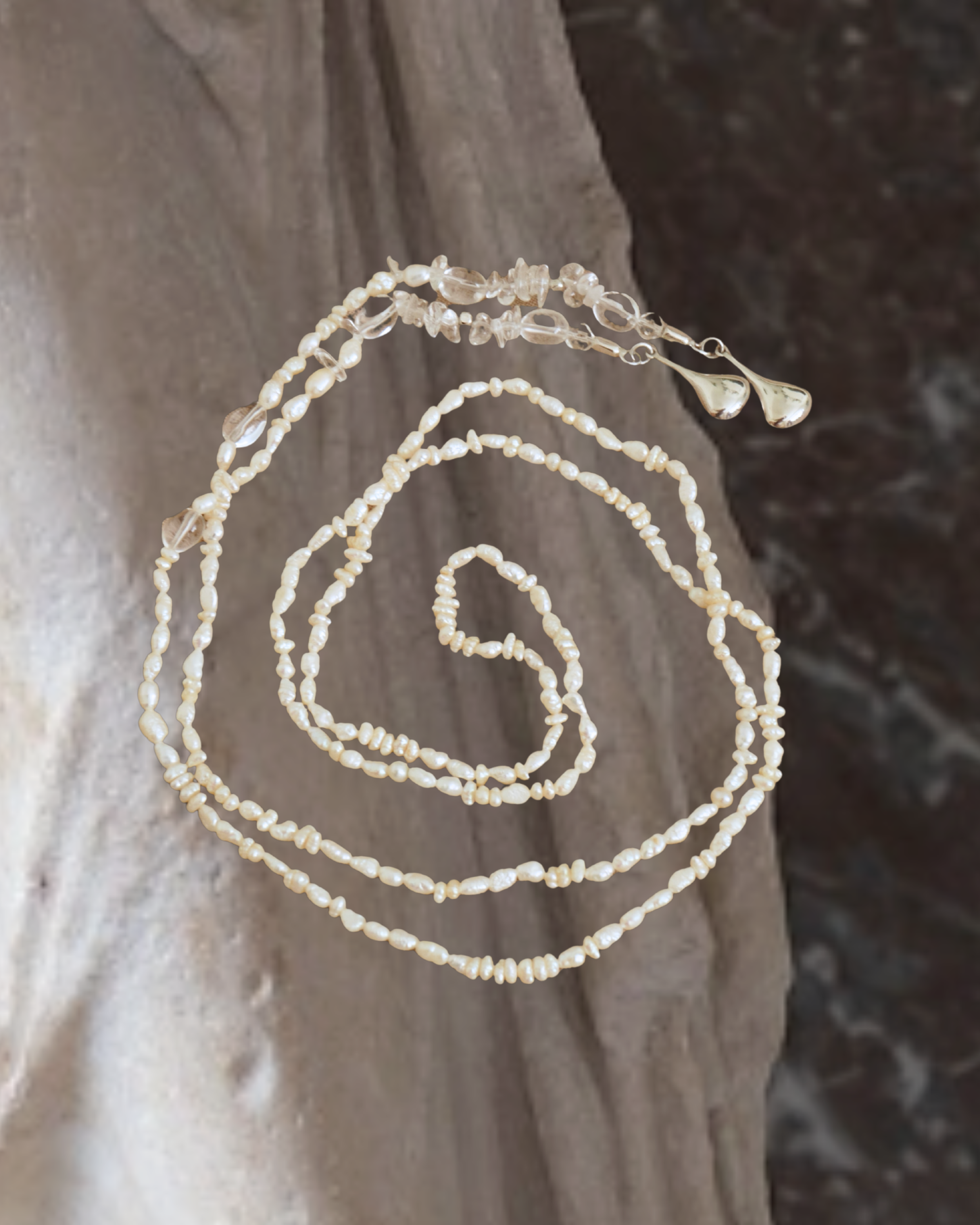 Long reclaimed pearl & clear quartz pendant