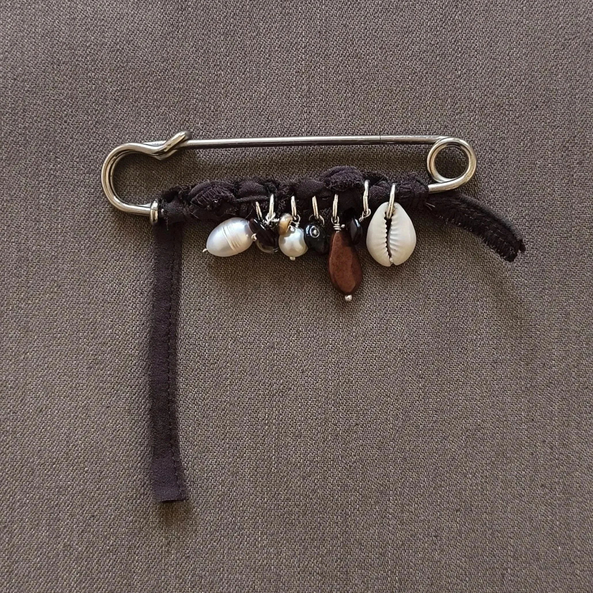 Large kilt pin with trinkets & silk