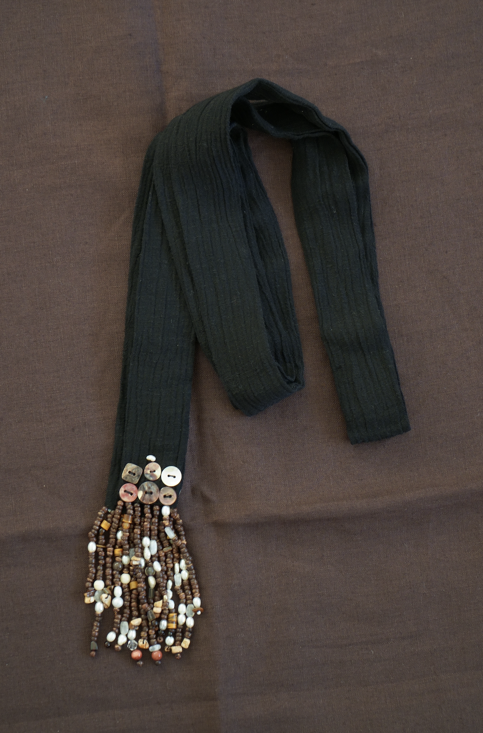 Black cotton scarf with bead & stone fringe.