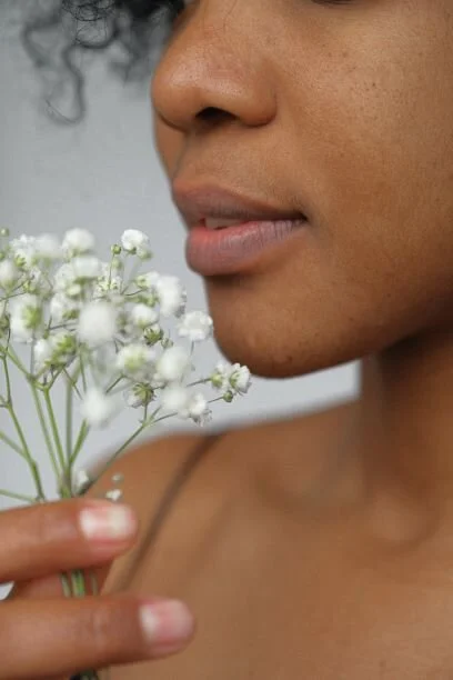 Canva - Woman Holding White Flowers 1.jpg