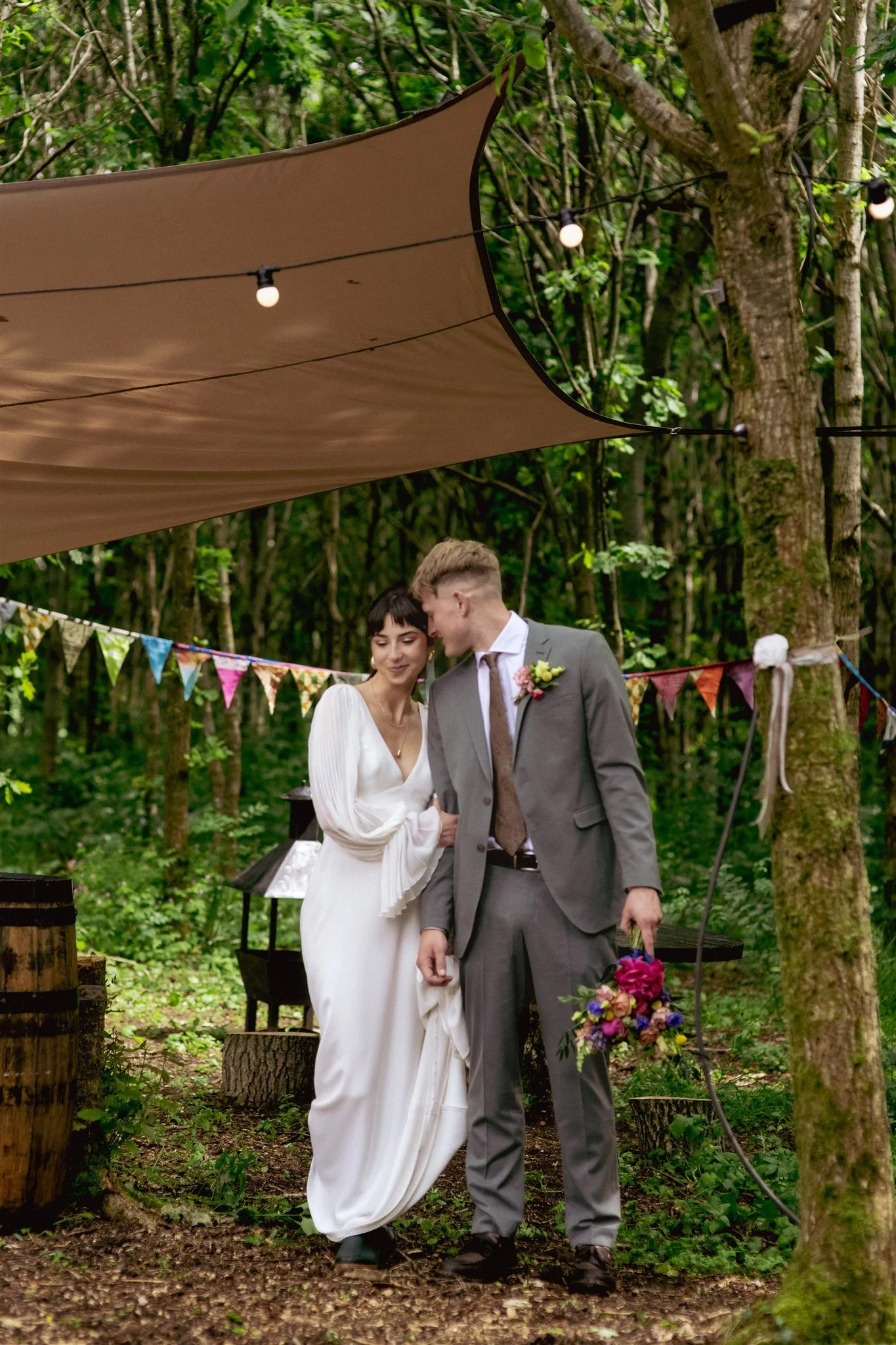 Relaxed outdoor wedding portrait of a couple photographed naturally by a Northern Ireland wedding photographer