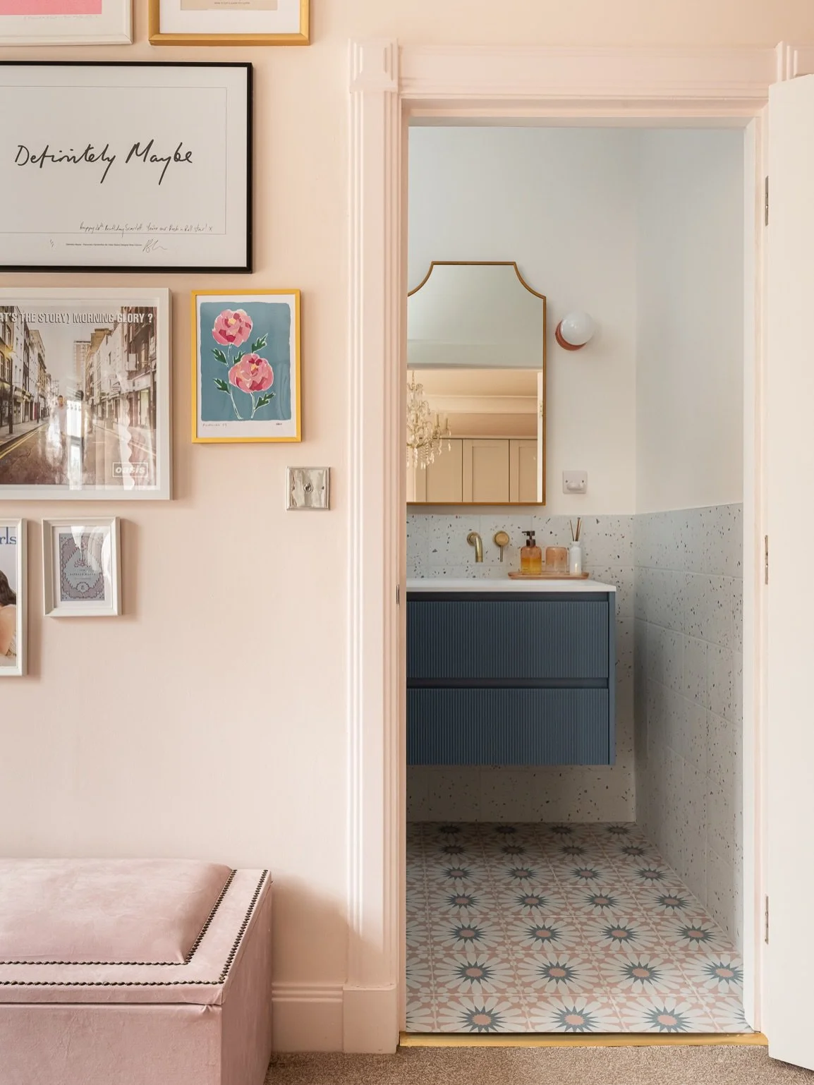 We transformed a dull, windowless bathroom into a vibrant space that reflects the client's personality. This gorgeous bathroom is not only visually stunning but also highly functional, featuring ample storage with a mirror cabinet and vanity drawers.