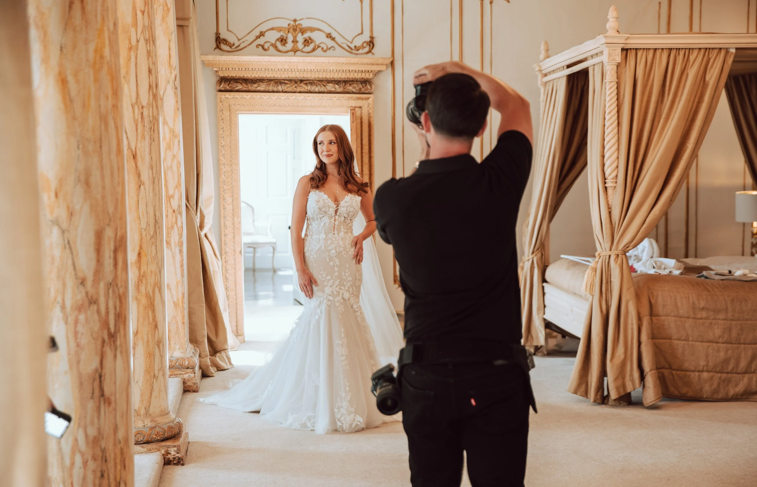 Behind the scenes portrait of Bride in gorgeous bridal suite at Gosfield Hall, Golden interior, behind the scenes wedding photography image