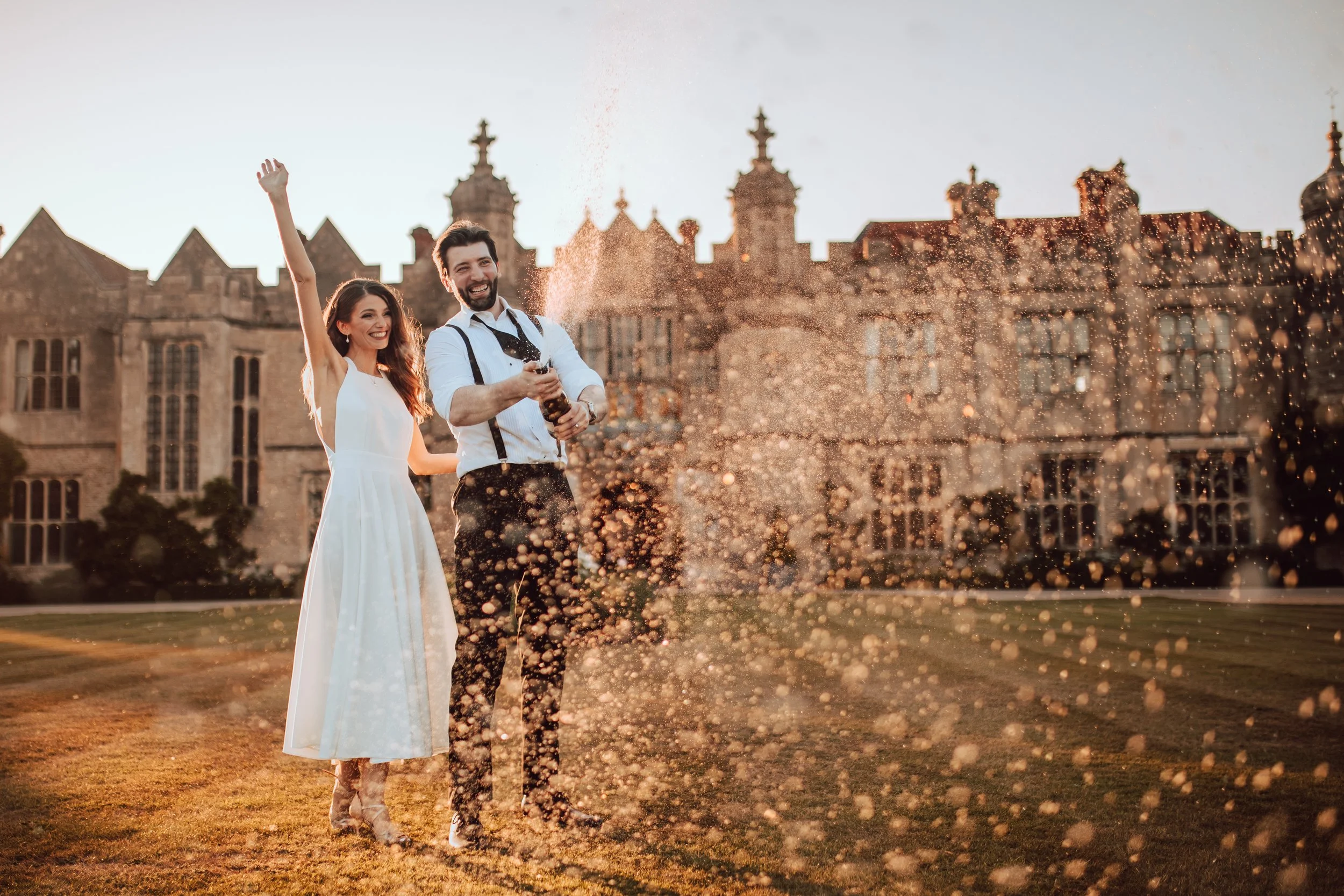 Editorial Wedding Day Champagne Spray captured by Wedding Photographer Liam Gillan at Hengrave Hall