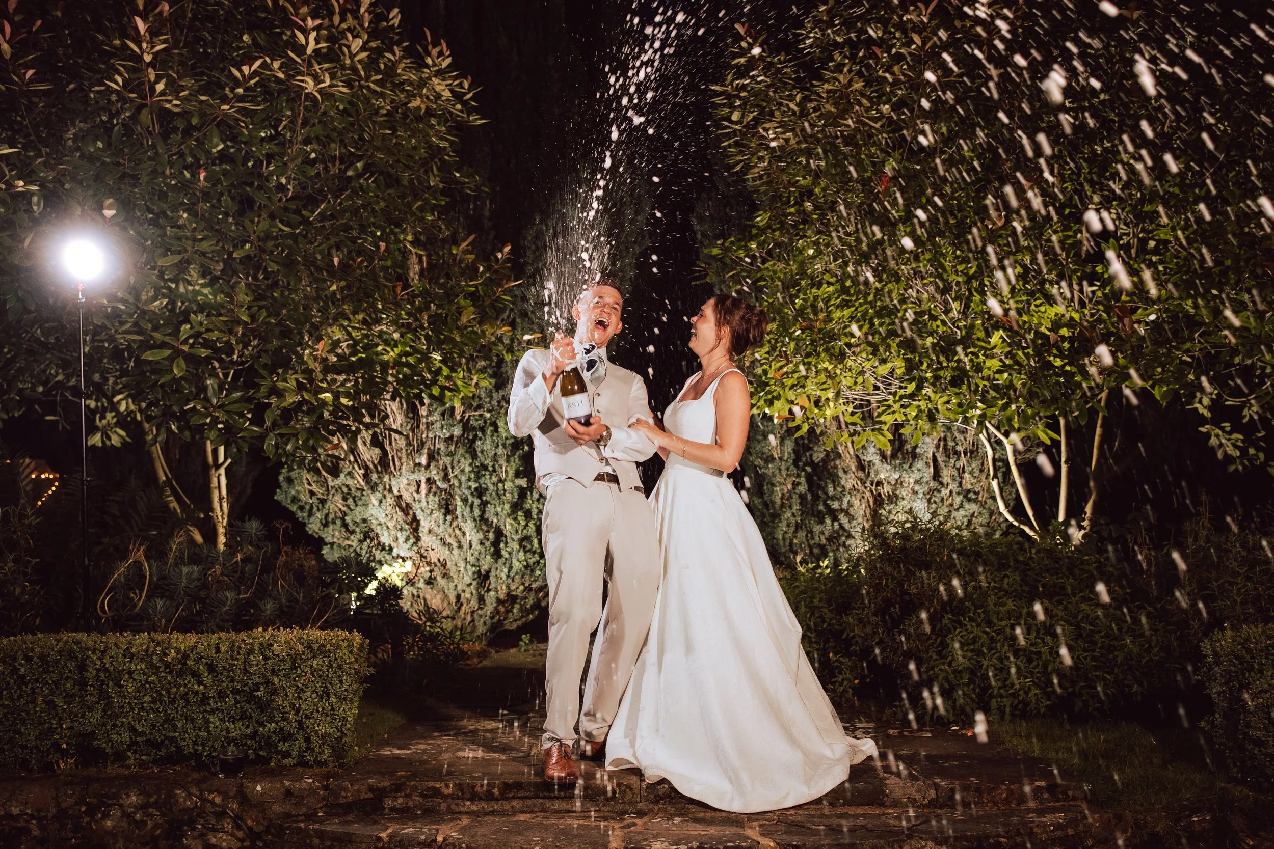 Wedding Day Champagne Spray captured by Wedding Photographer Liam Gillan in Kent