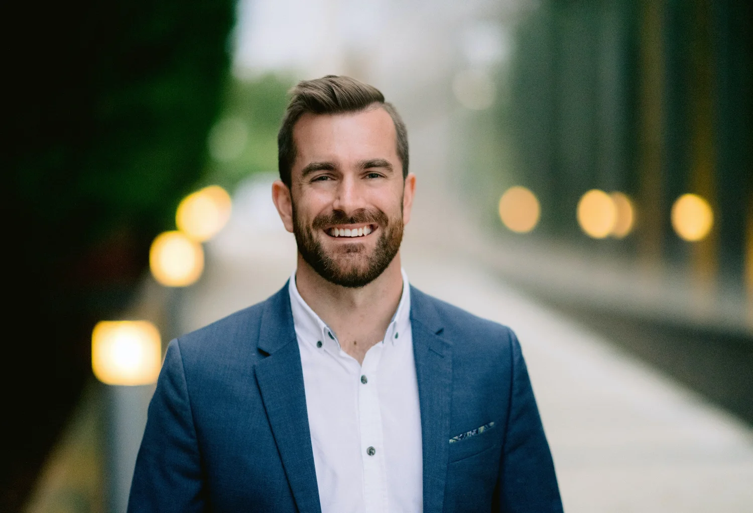 Dave Whiteside, Ph.D, smiling in a navy blazer