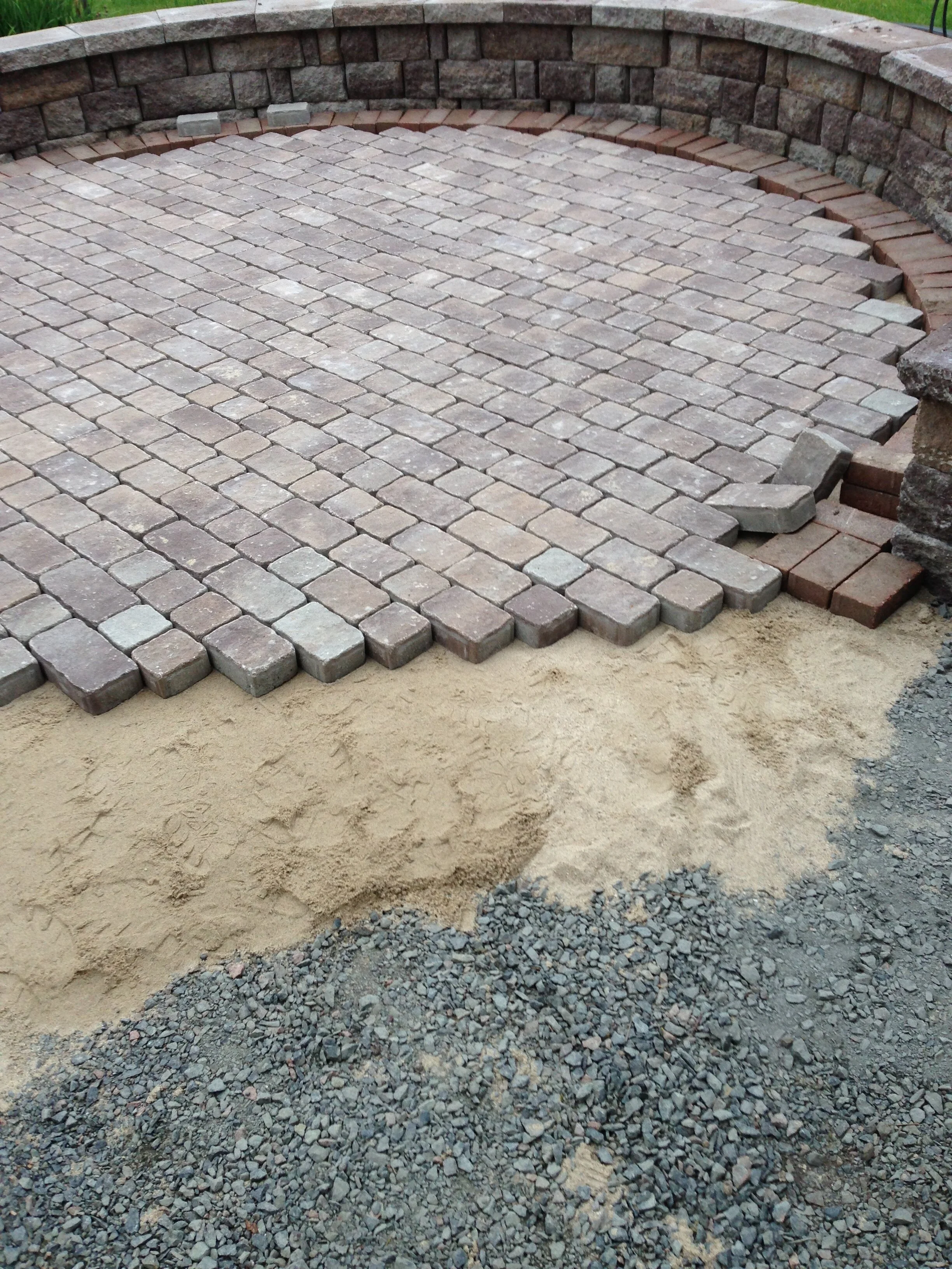 Multiple layers of gravel and sand for the foundation.