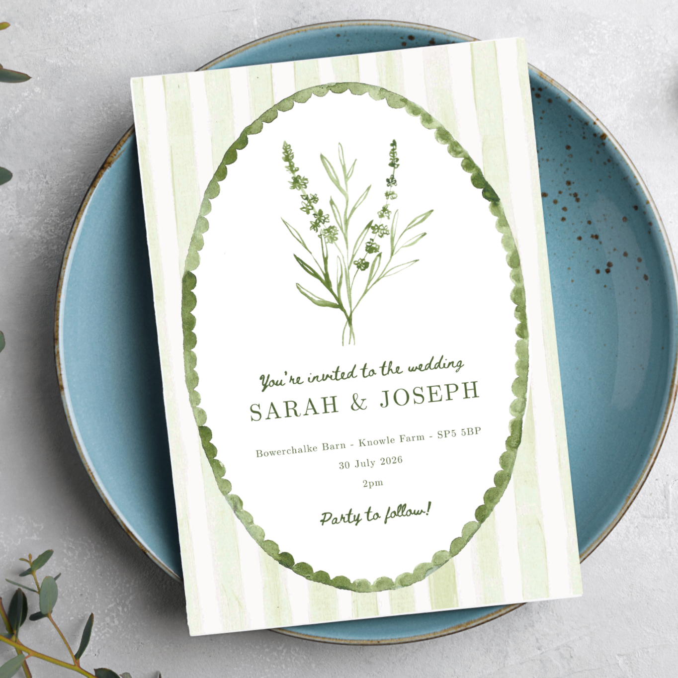 green  and white striped wedding invitation design with calligraphy names and white wavy border around the details