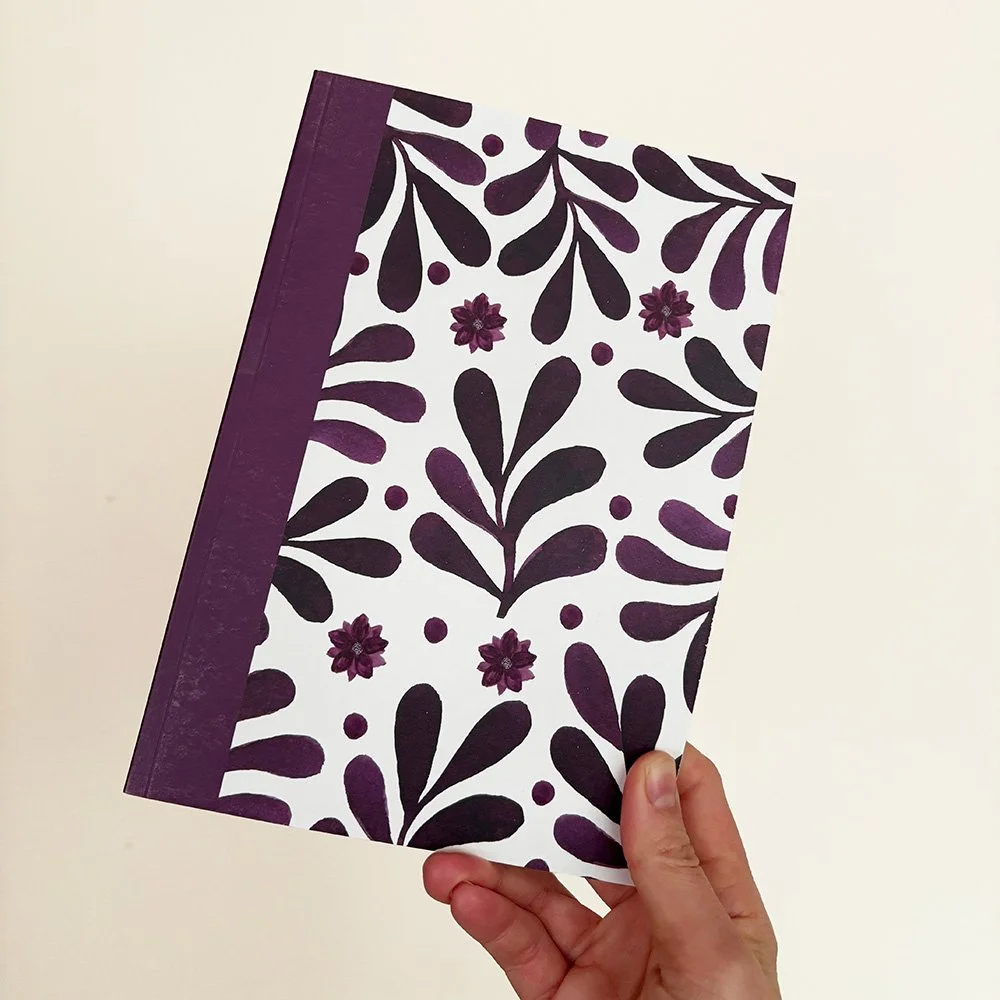 A5-notebook-purple-hand-web.jpg