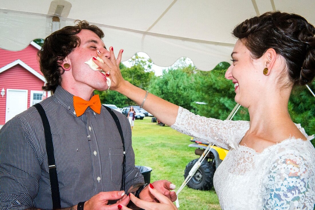 NH-bride-smashing-cake-in-groom.jpg
