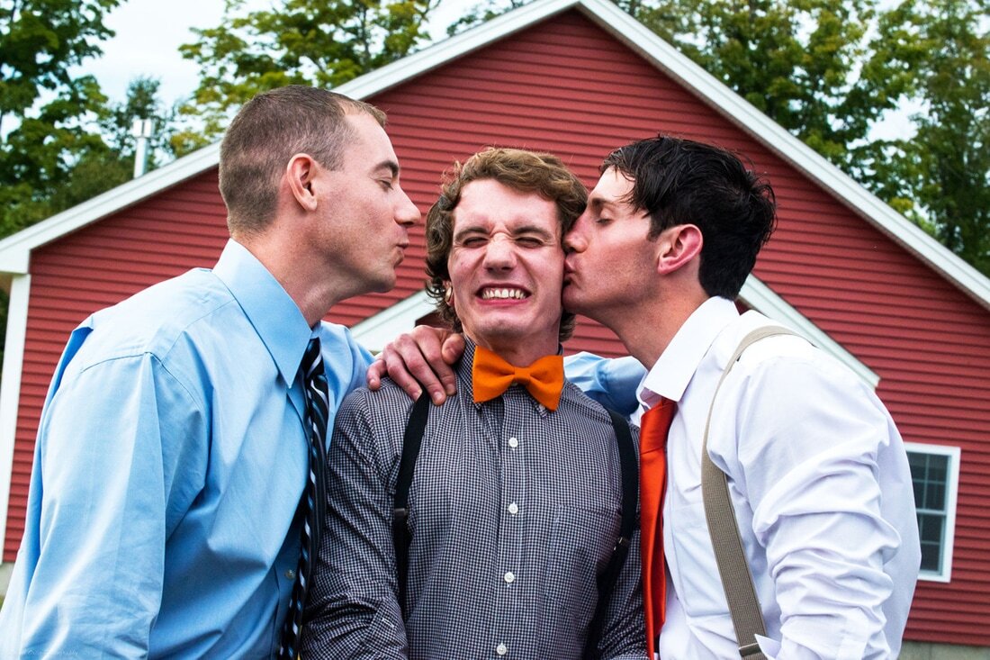 nh-groom-kissing-friends.jpg