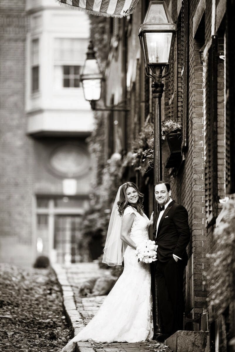 boston-acorn-street-bw-wedding-couple-flag.jpg