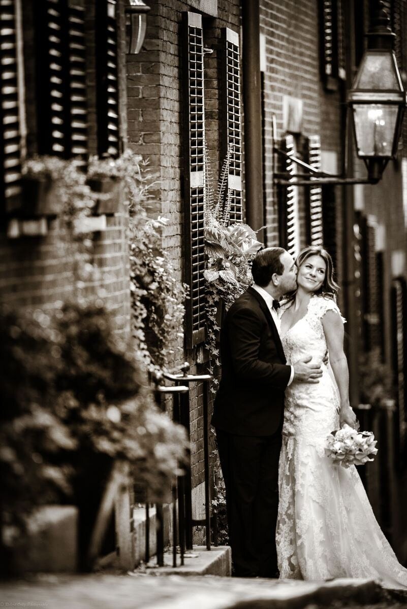 boston-acorn-street-wedding-groom-kissing-bride.jpg