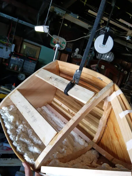 hung from the rafters to add the insulation