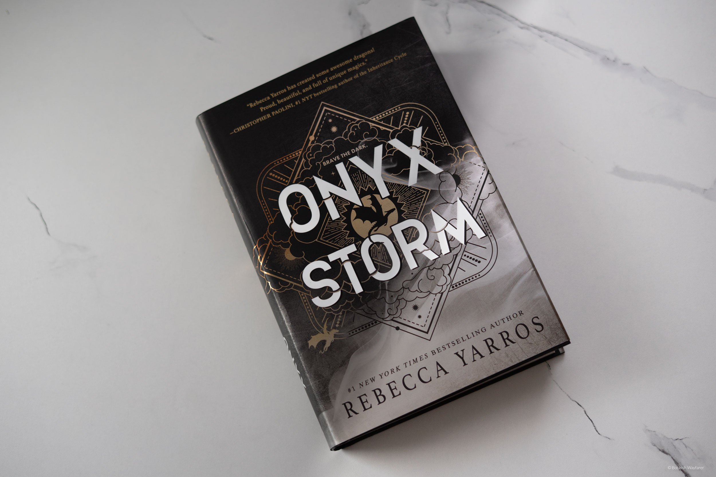 The book Onyx Storm laid flat atop a table