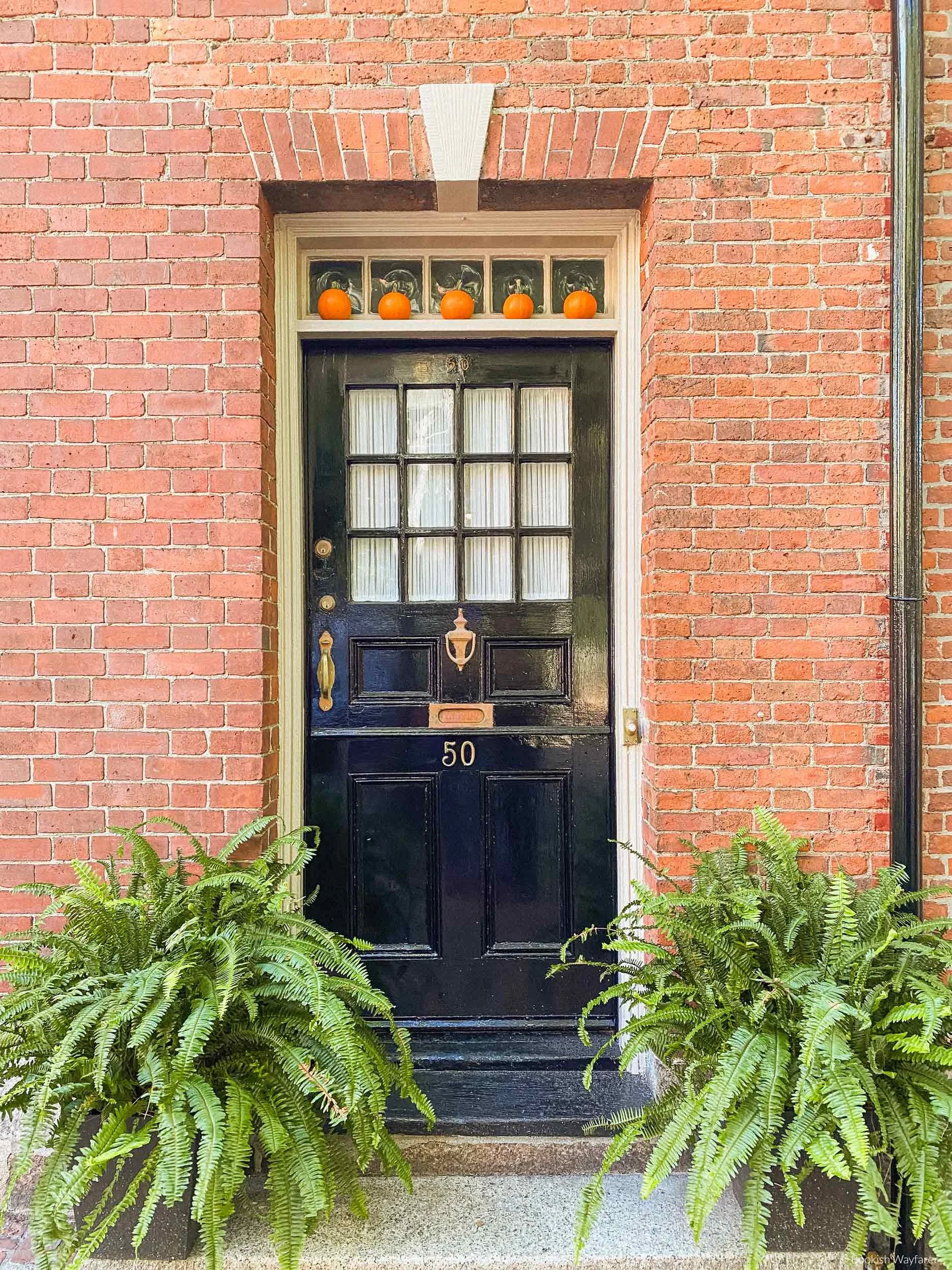 Front door of a brick Beacon Hill townhouse