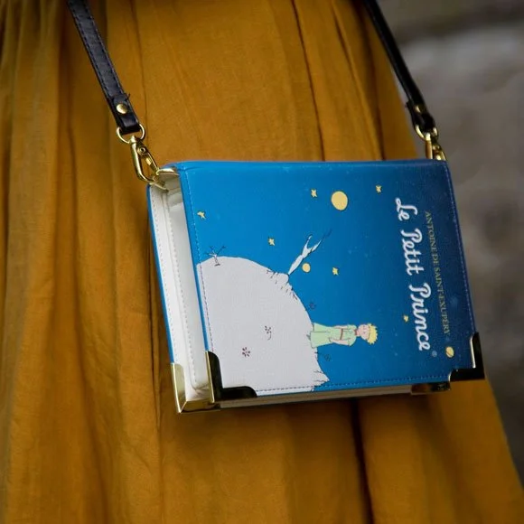 A bag made to look like the book Le Petit Prince