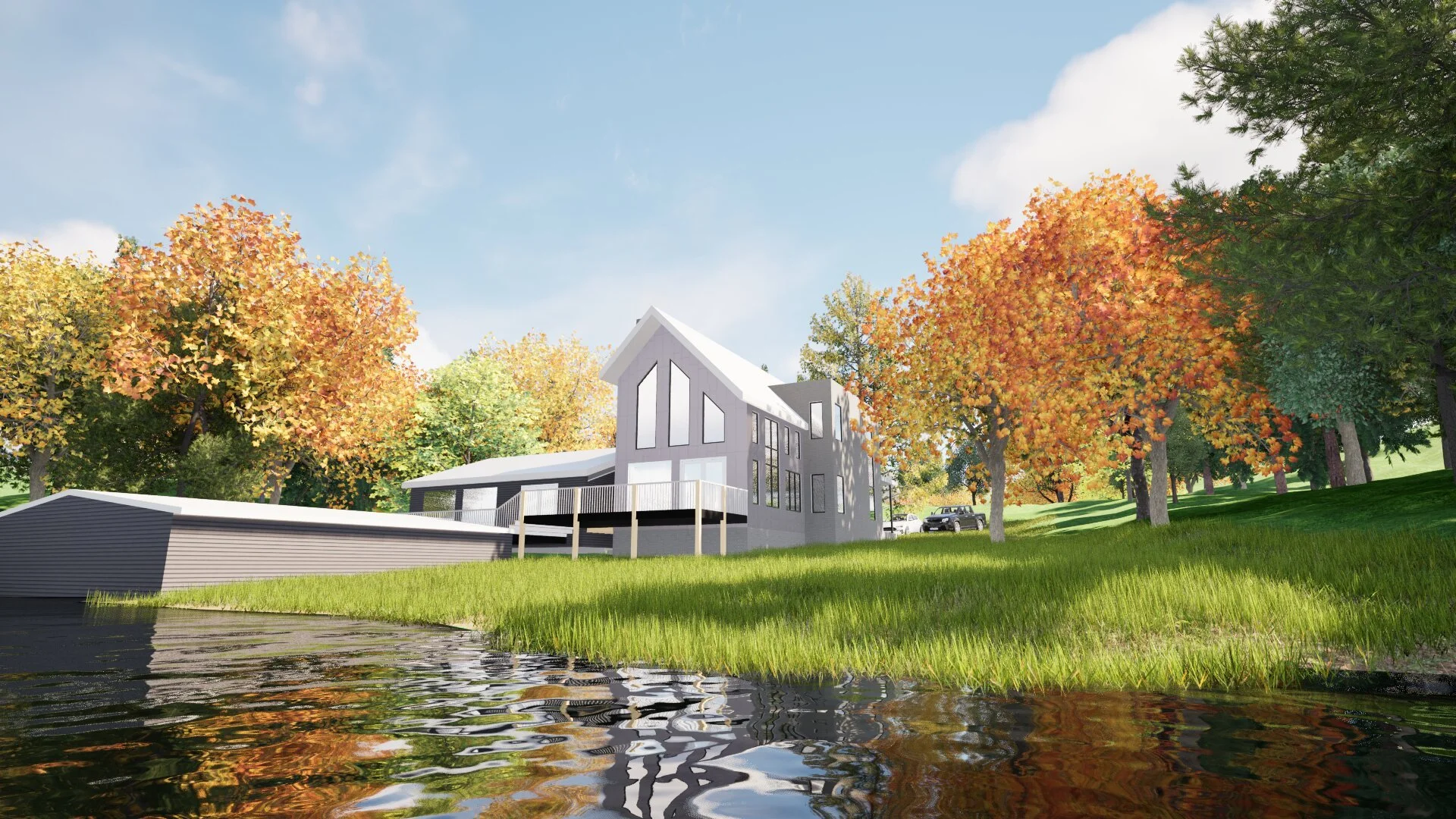 A modern house with large windows and a balcony, set on a grassy hillside with colorful autumn trees and a pond in the foreground, under a partly cloudy sky.
