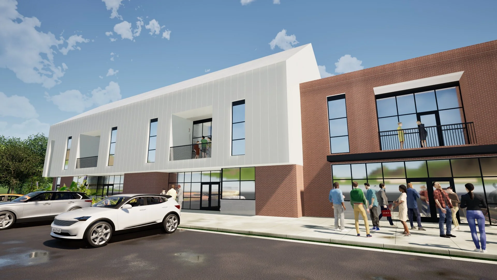 A modern mixed-use building with retail space on the ground floor and residential units above. People are walking on the sidewalk, and cars are parked along the street. The building has a combination of white and brick exterior with large windows and balconies.