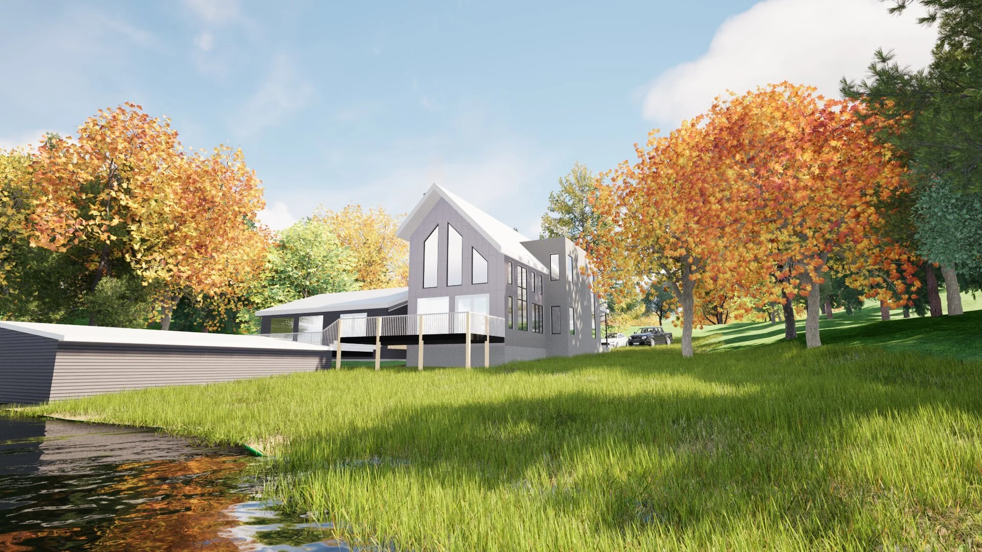 A modern house with large windows on a grassy hillside surrounded by colorful autumn trees, next to a water body with a small dock in the foreground.