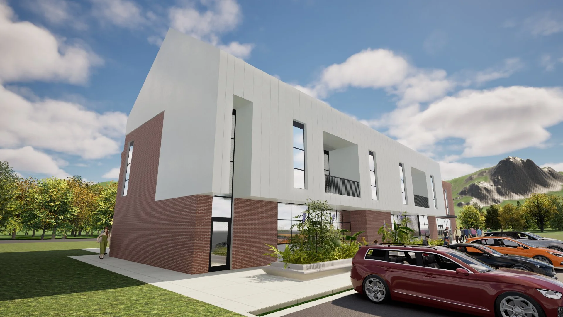 Rendering of a modern multi-story building with a brick and white exterior, large windows, and a parking lot with cars, set against green landscape with mountains in the background.