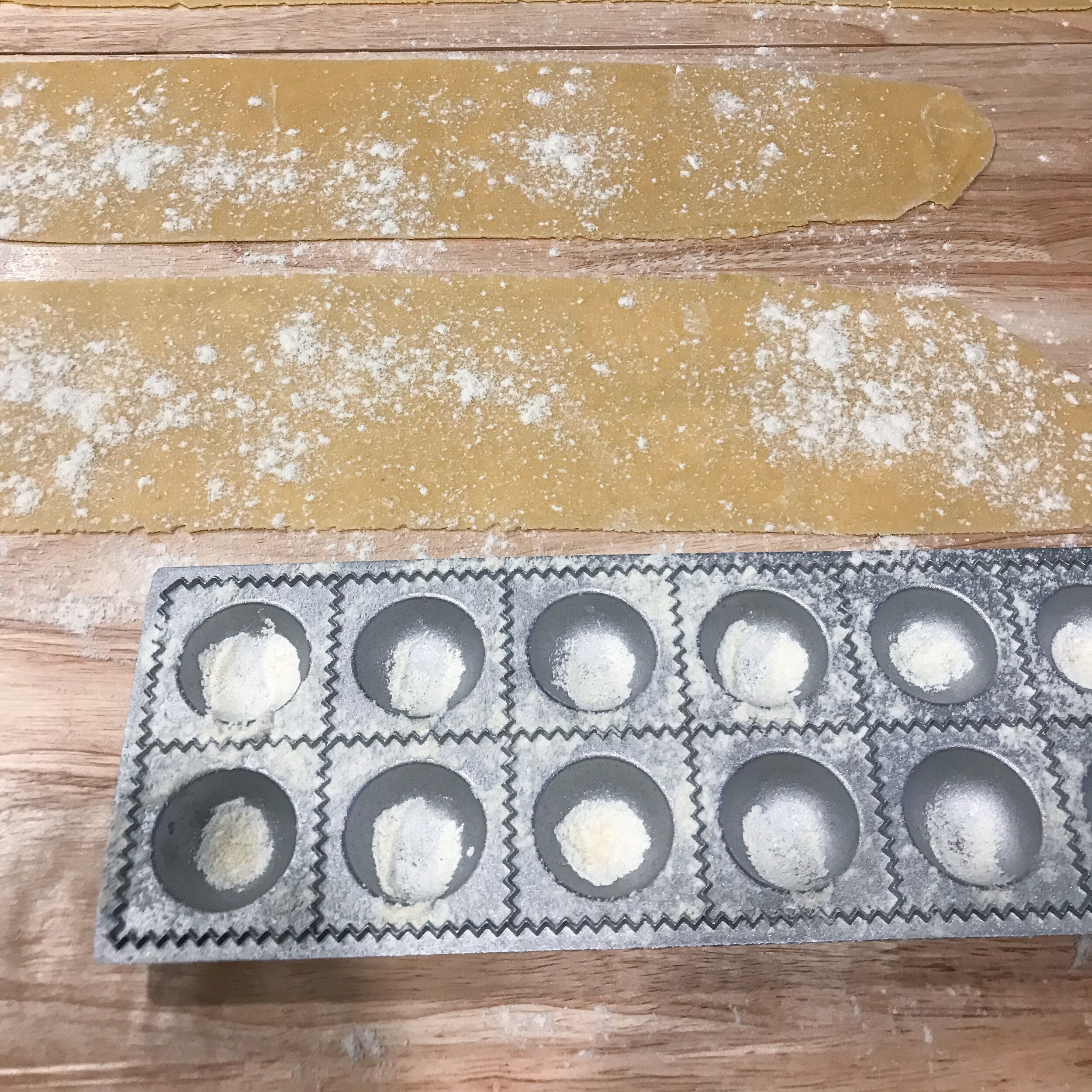 To make ravioli with a mold, stretch each sheet to fit the width of the mold.