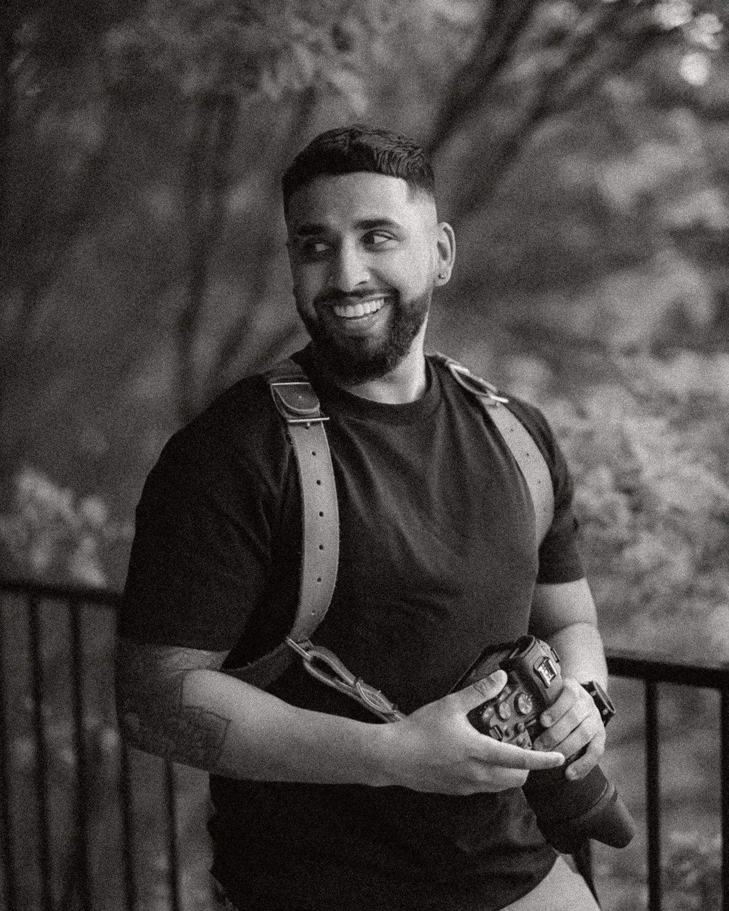 Smiling holding a camera in brisbane