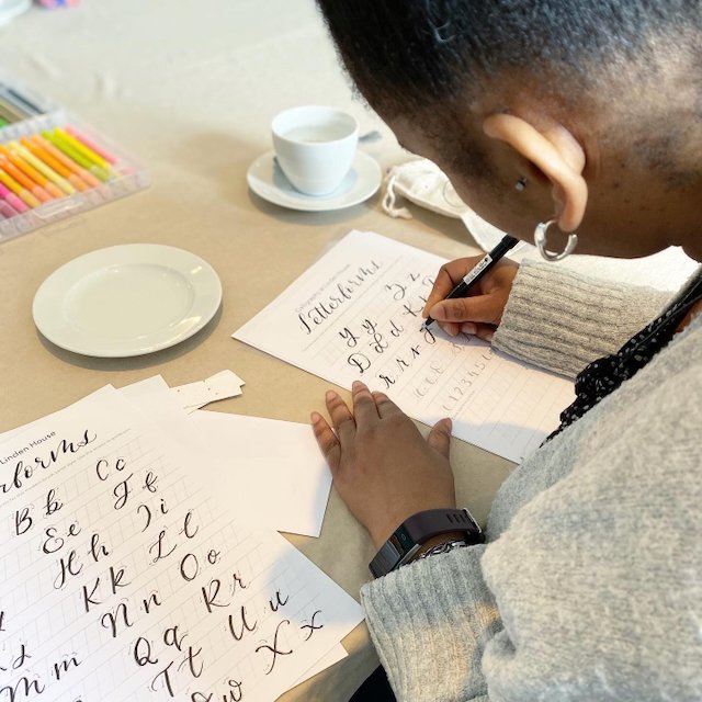 Woman learning brush pen calligraphy