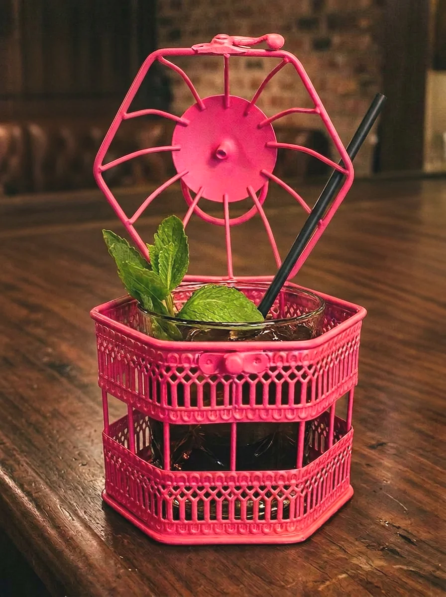 Fluro pink mini birdcage with cut glass cocktail glass inside with lid open
