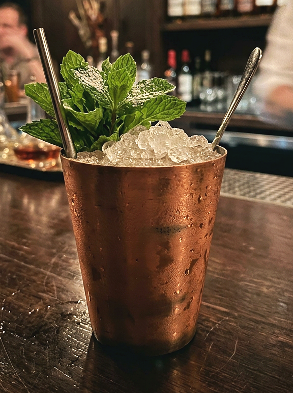Modern copper julep cocktail cup serving a mint julep
