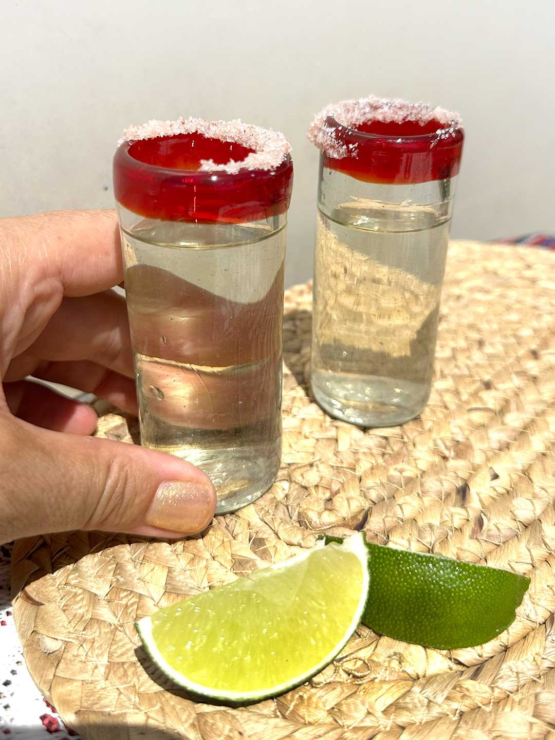 RED-RIM-HAND-BLOWN-MEXICAN-SHOT-GLASSES HAND HELD-WEB.jpg