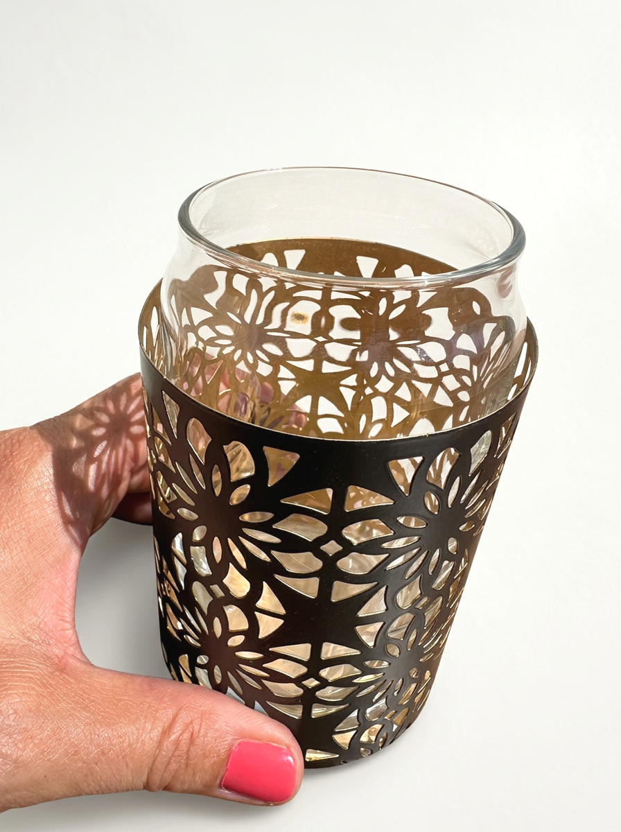 Moroccan inspired lattice cocktail glass shown empty on a white back groung