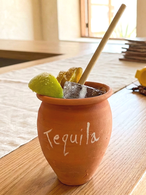Handcrafted clay cantarito cup on a bar counter, adding rustic Mexican character to a restaurant or home bar