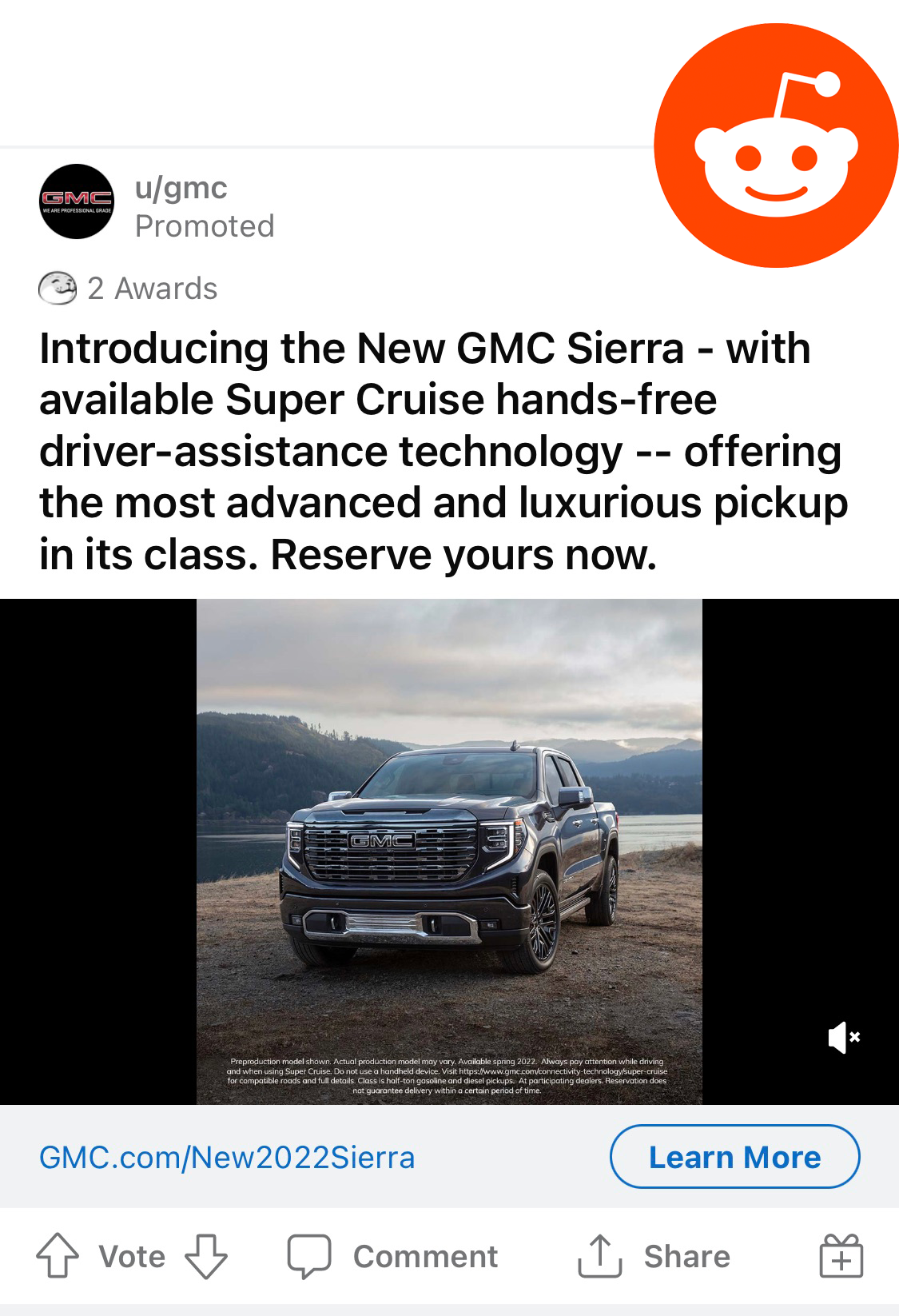 Advertisement for the new GMC Sierra pickup truck, showcasing a black truck parked outdoors with mountains and water in the background, promoting features like Super Cruise hands-free driver assistance technology.