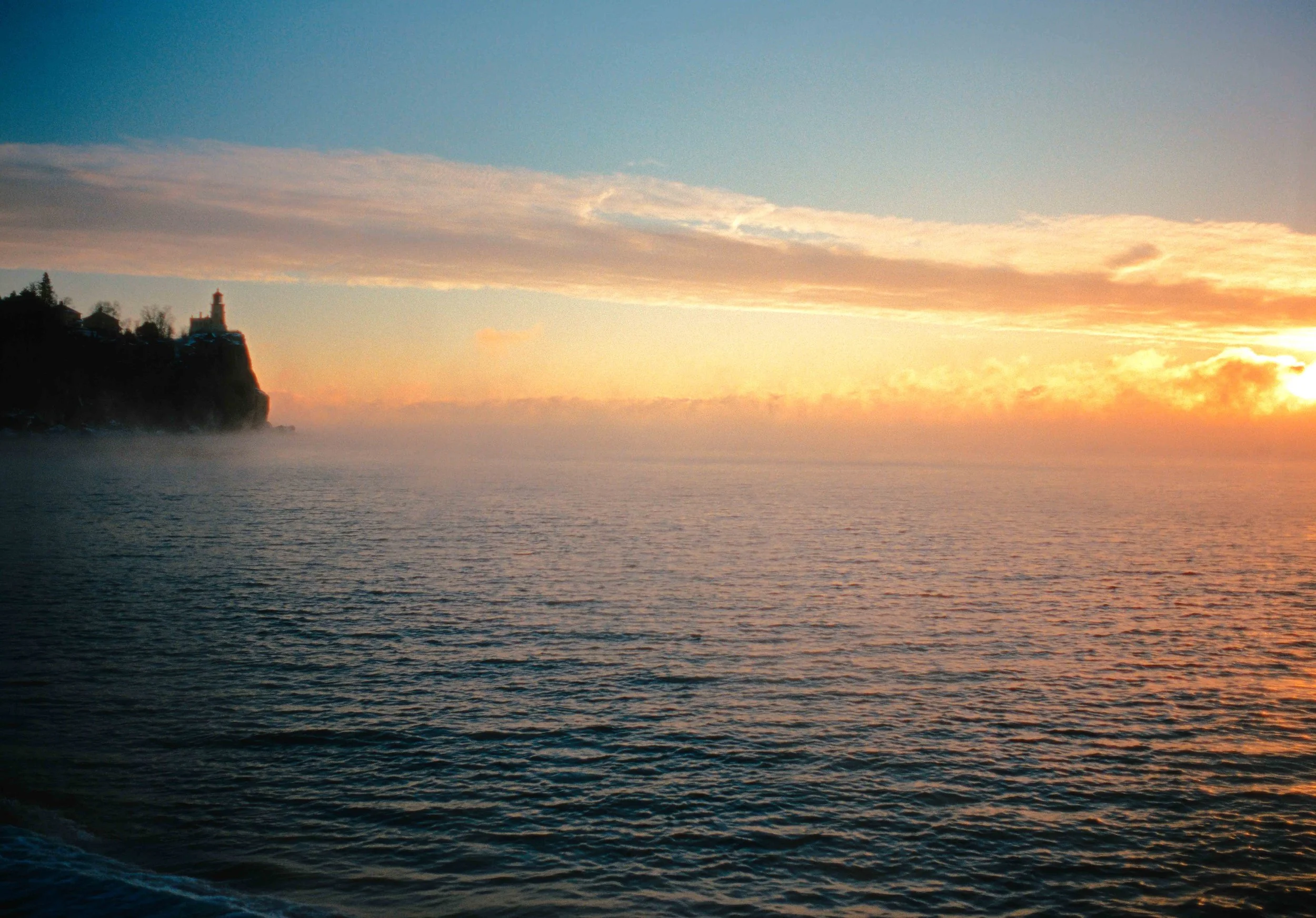 Dramatic Winter sea smoke sunrise at Split Rock Lighthouse on Lake Superior, Minnesota