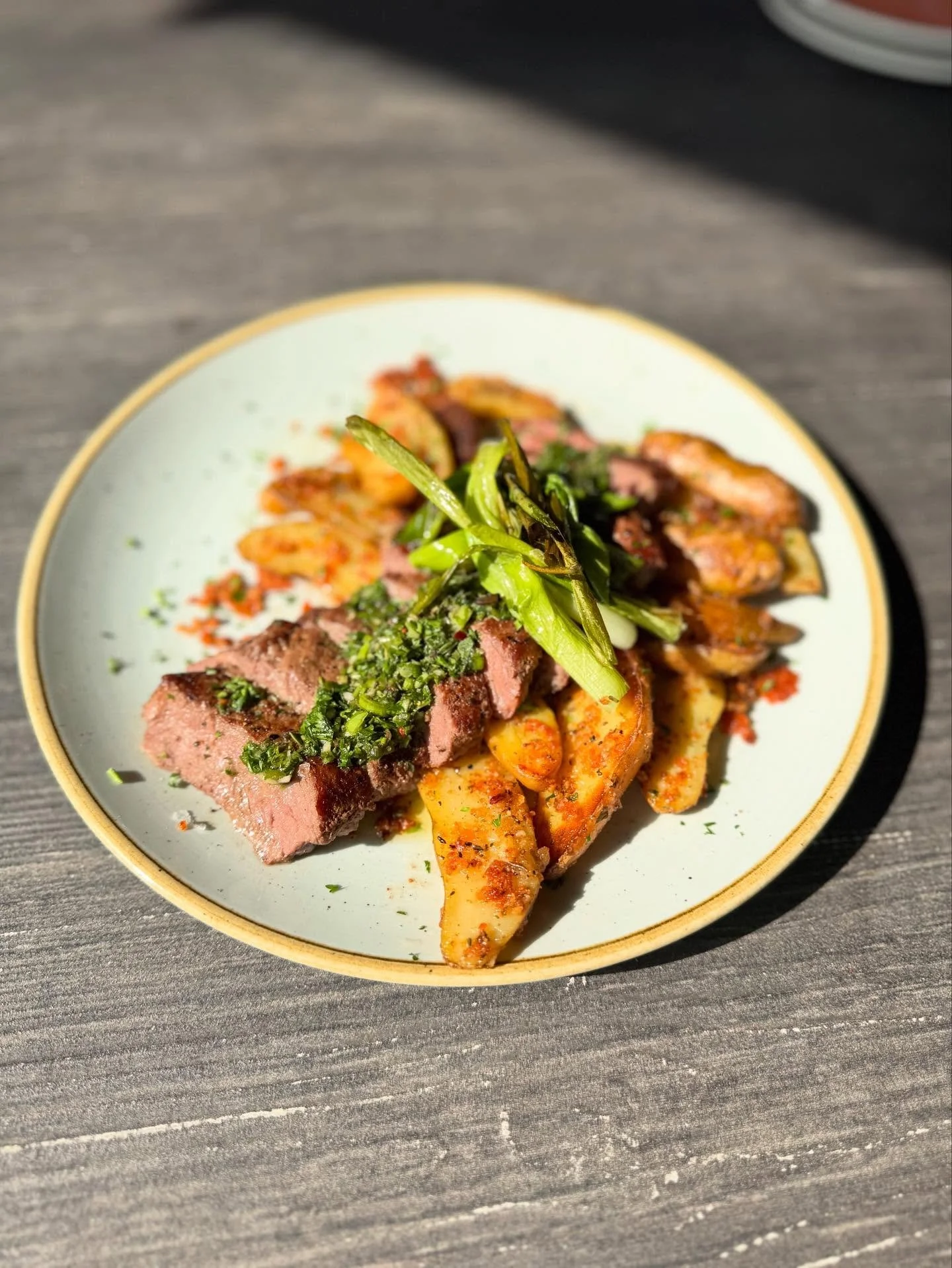 New Menu Item! 🚨 🥔 🥩 

Introducing our Flat Iron Steak with roasted garlic-Parmesan potatoes, house-made chimichurri, charred scallions, garlic aioli, and almonds! 

Come try it tonight during trivia, starting at 7pm! Here&rsquo;s a hint to one of