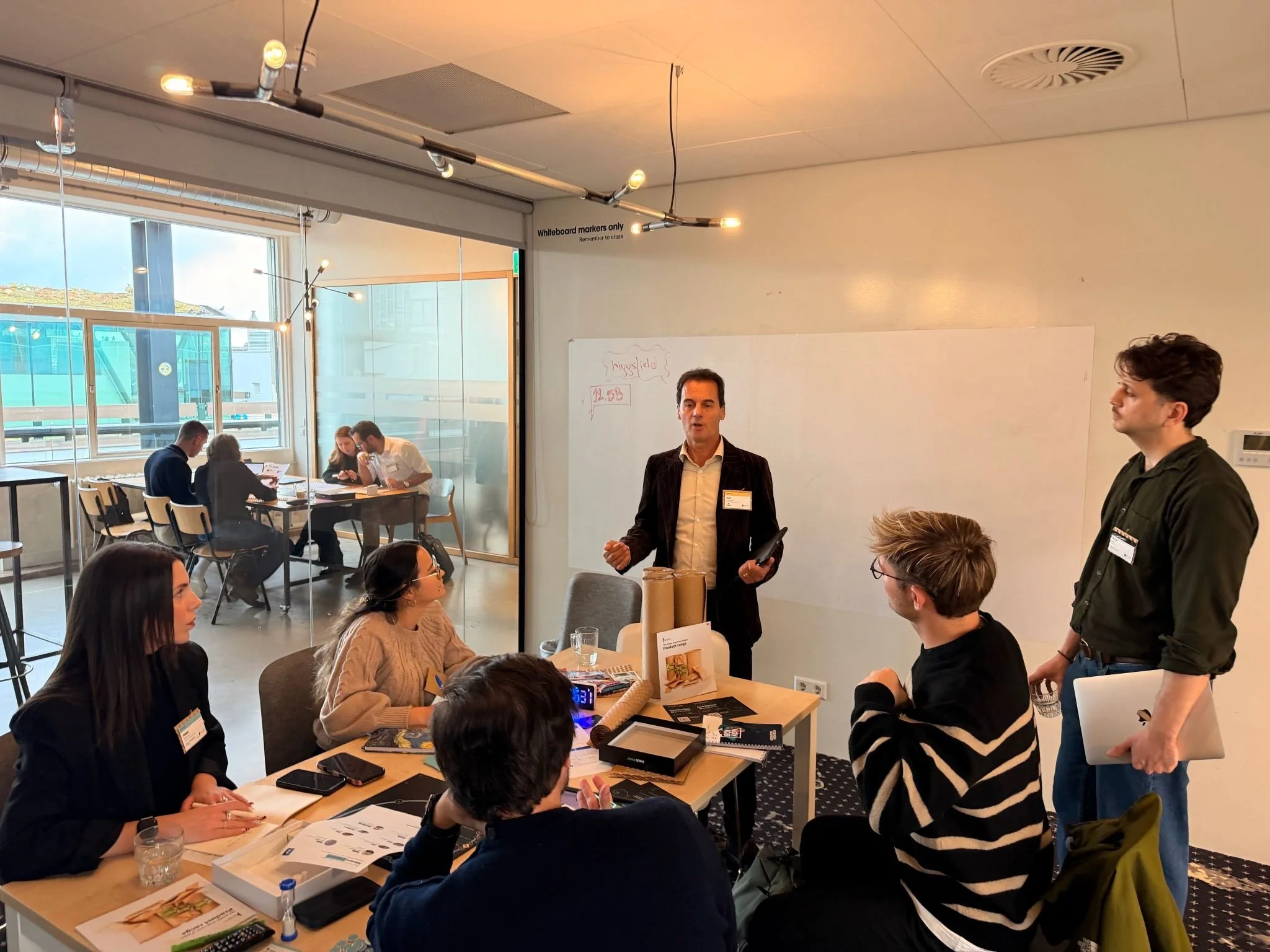 Team discussion with mentors at the H/Pack for 2030 sustainable packaging hackathon