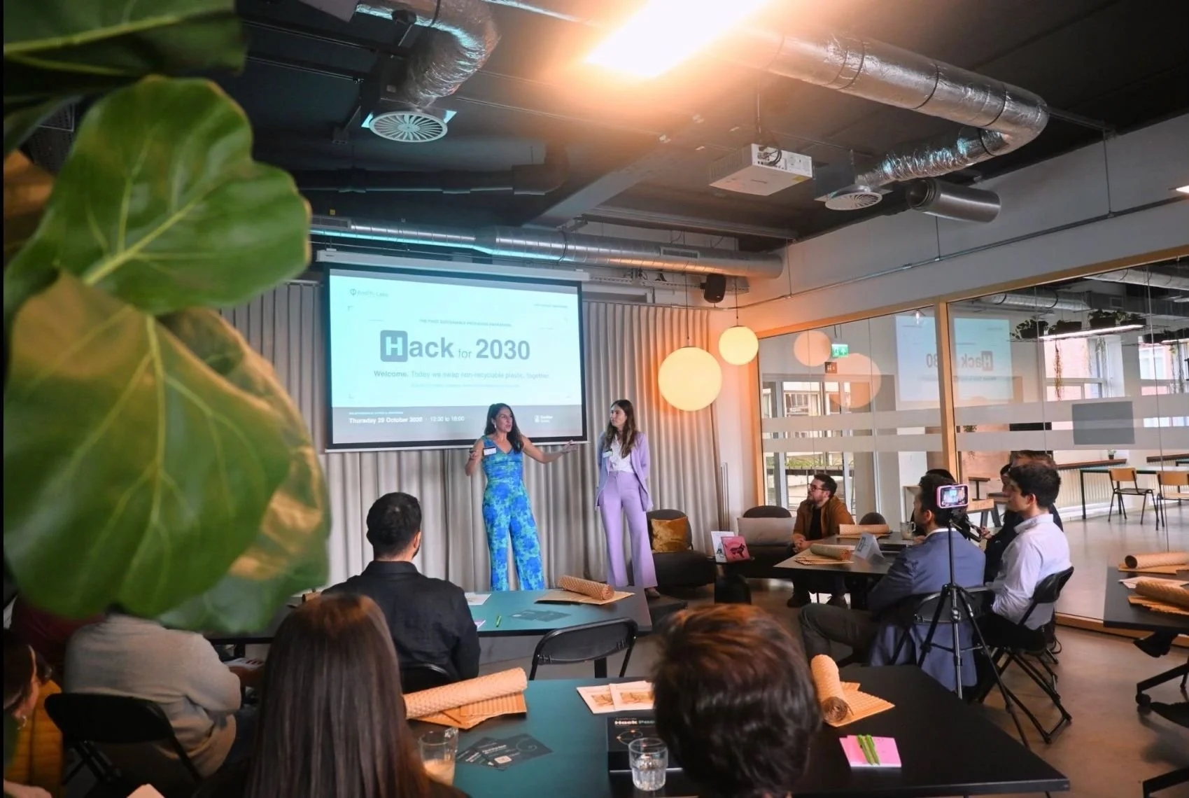Anna Oñate and Camila Bühler welcoming participants to H/Pack for 2030 in Amsterdam