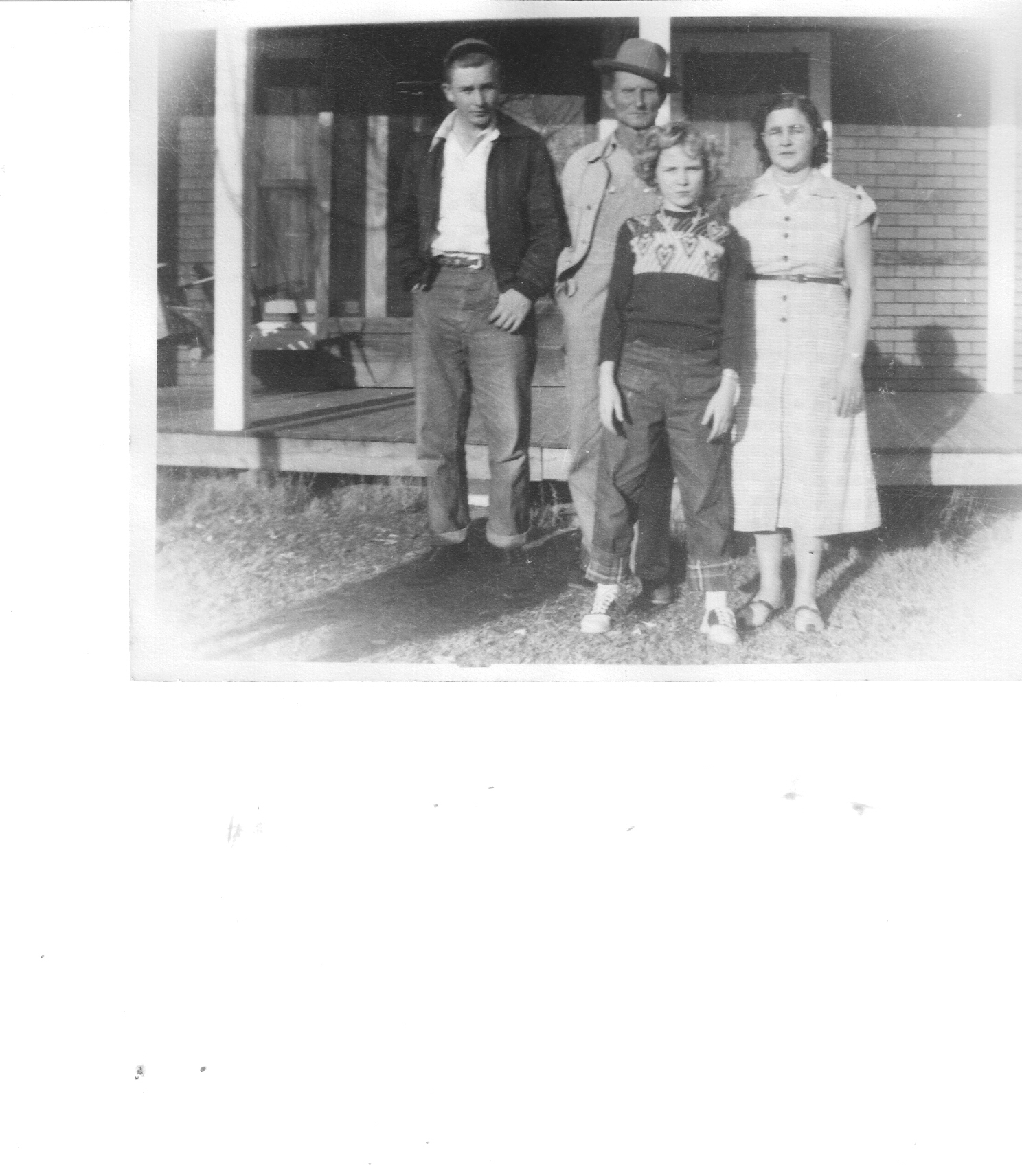 Vintage photograph of Dee's family at the farm in Arkansas