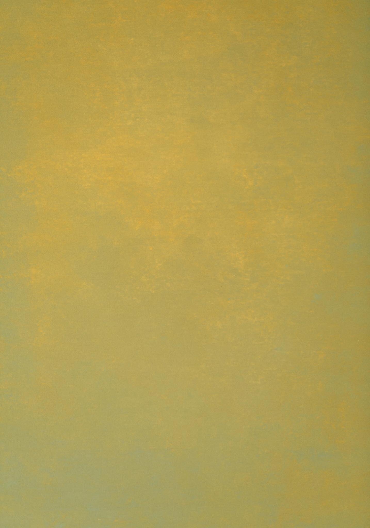 Close-up of a yellow surface with a textured appearance.