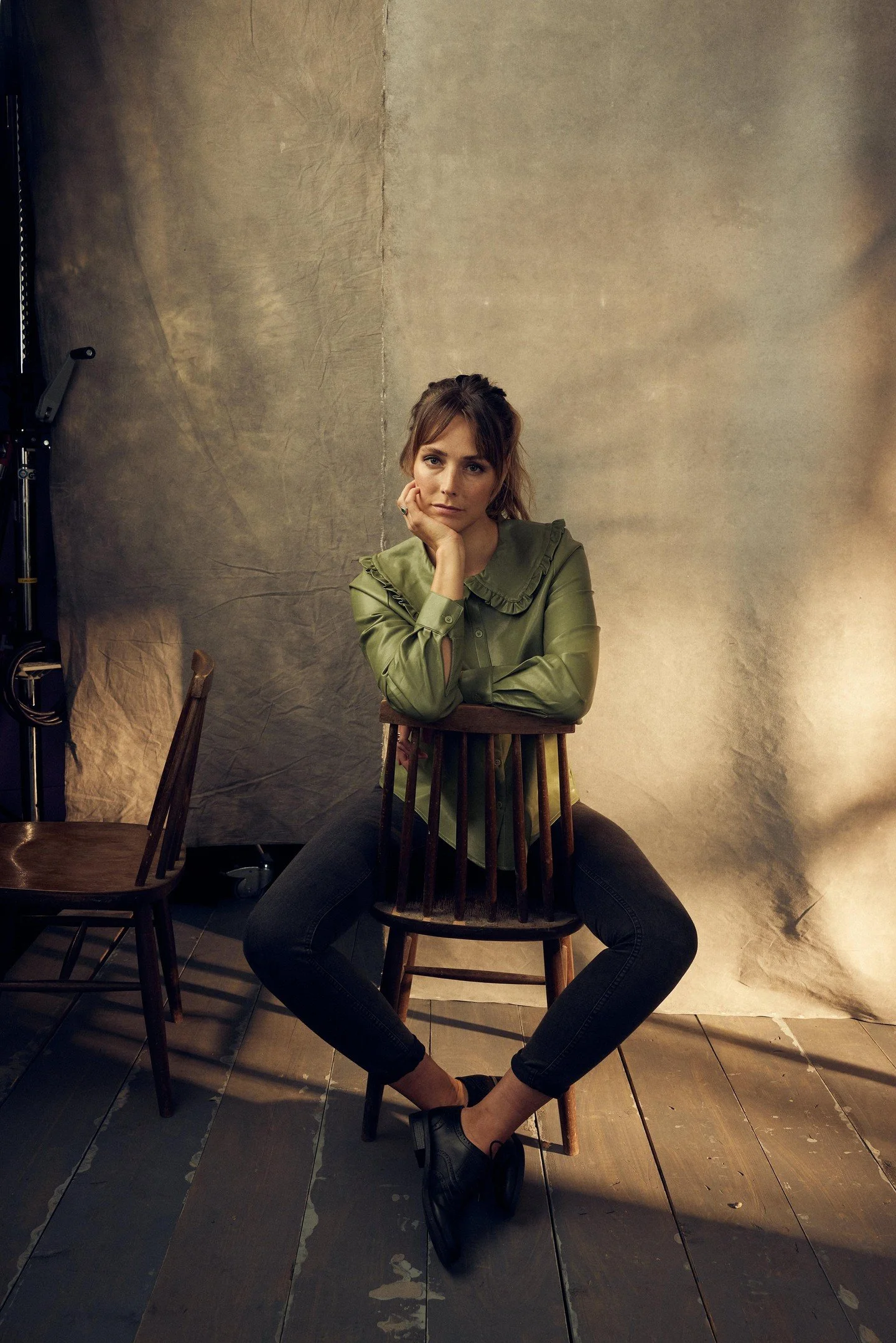 That soft directional lighting is creating the most delicate shadow play across this hand-painted backdrop turning those muted neutral brushstrokes into living dimension - watch how light sculpts gentle shadows on the wooden floorboards and lets text