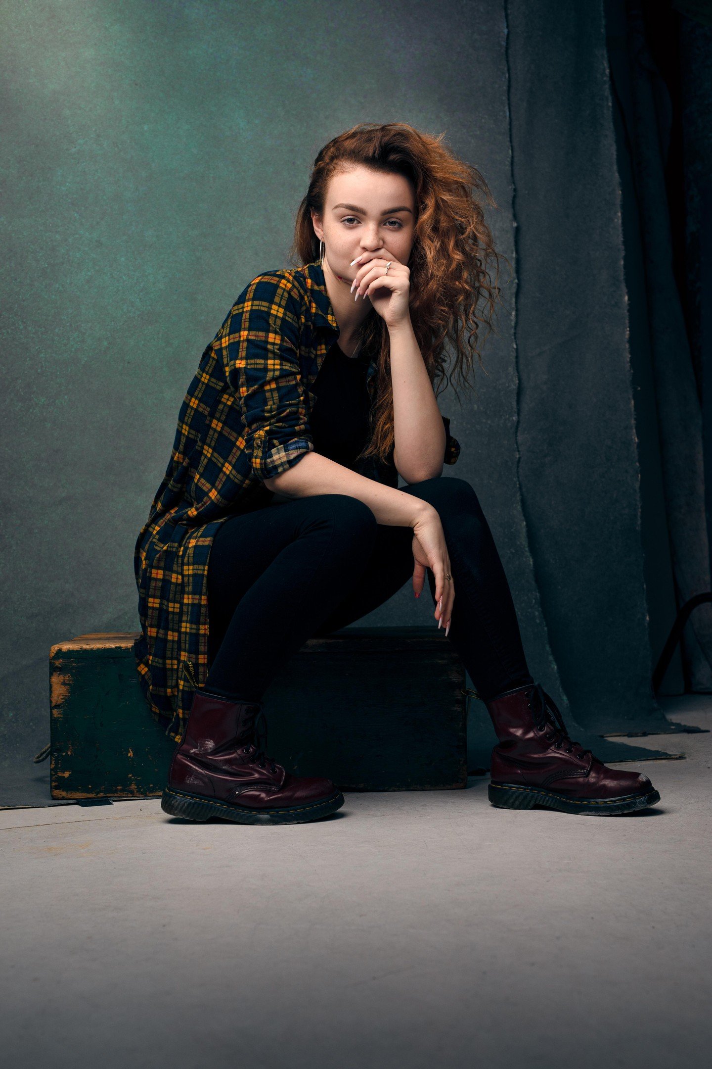 That soft diffused lighting from a large softbox is doing beautiful work here wrapping around her features and creating those gentle shadows that add dimension without going harsh spotlight villain interrogation mode - see how it illuminates her plai