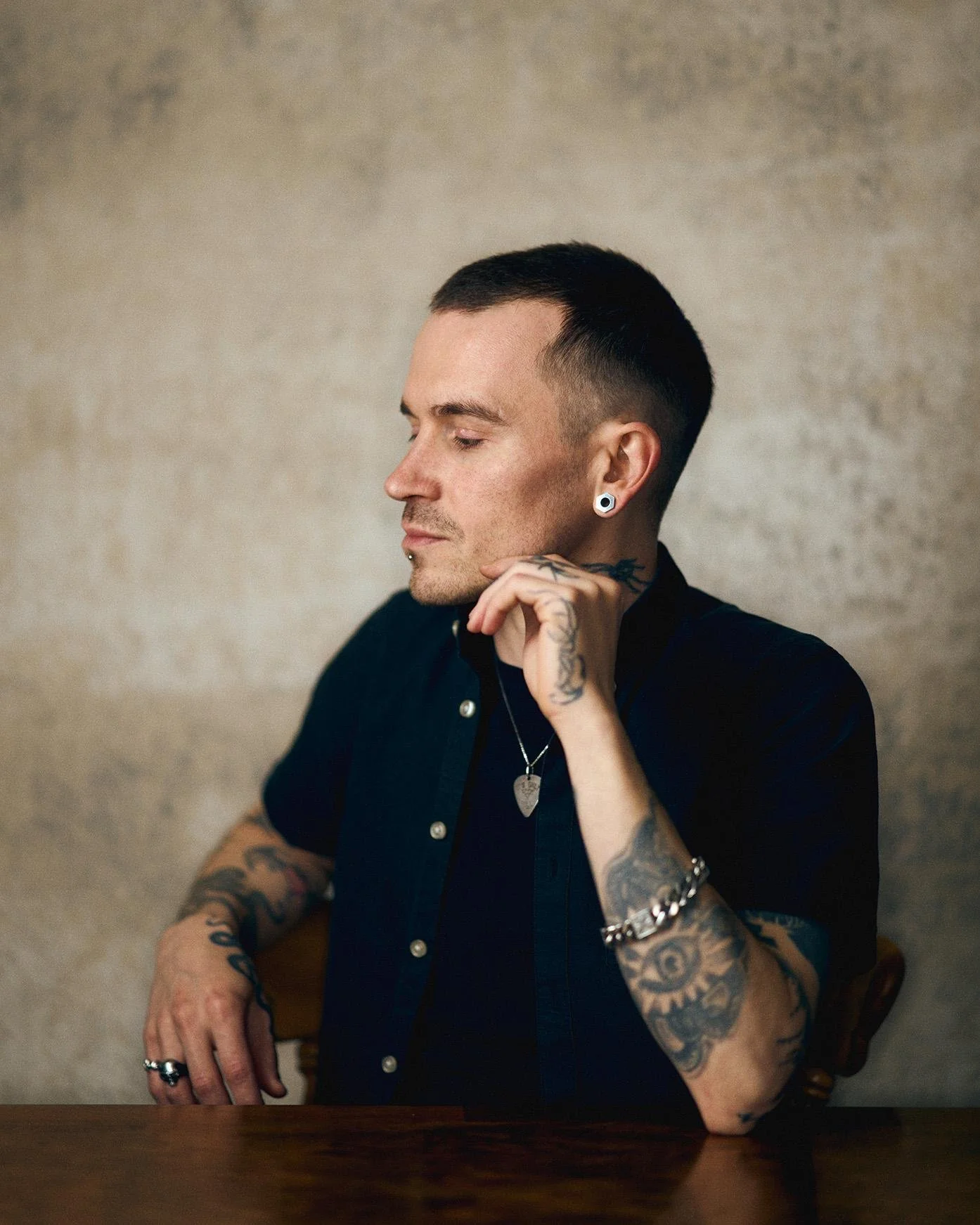 That soft even lighting is working magic here wrapping around him like a gentle hug instead of harsh spotlight interrogation - you can see how those diffused shadows add just enough dimension to emphasize his facial features and let every line of tho