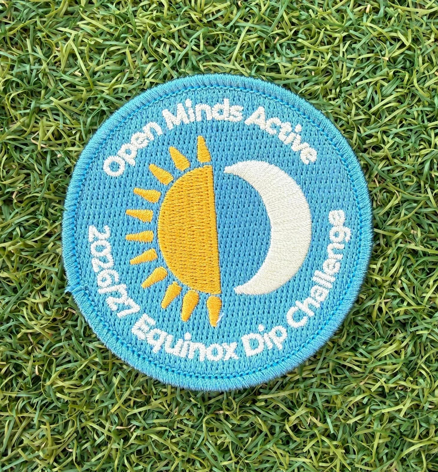 Sew on badge on grass.jpeg