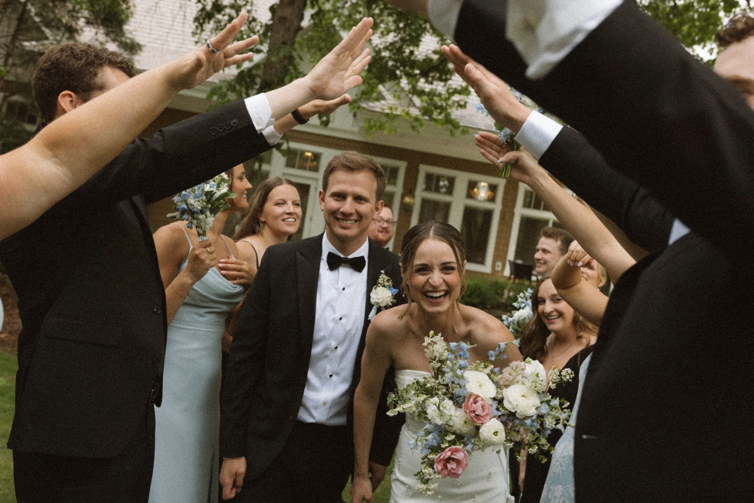 happy wedding party at a spring wedding, Bearpath Country Club wedding in Eden Prairie MN
