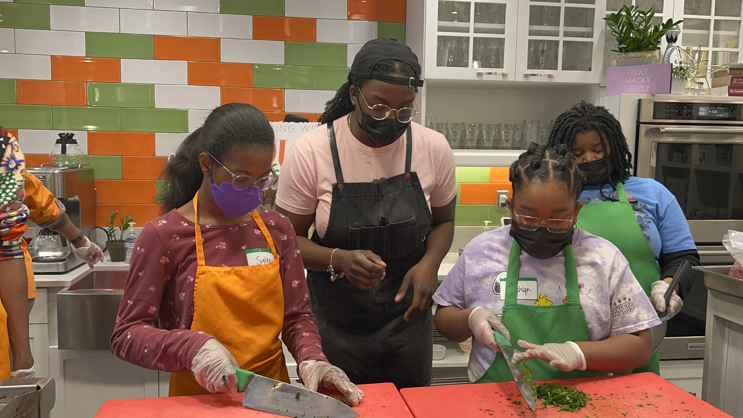 Children participating in a Kitchen Kids cooking experience